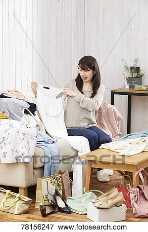Stock Photo - Japanese woman buying online. Fotosearch