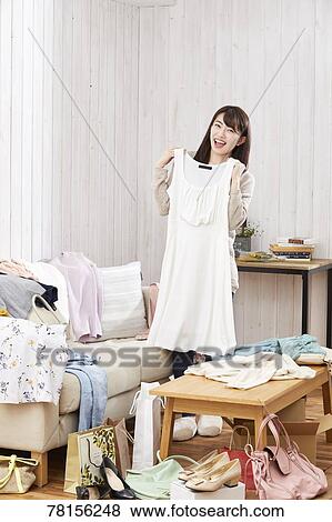 Stock Photo - Japanese woman buying online. Fotosearch