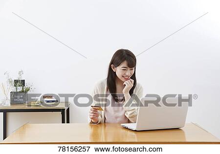 Japanese woman buying online View Large Photo Image Stock Photo - Japanese woman buying online. Fotosearch
