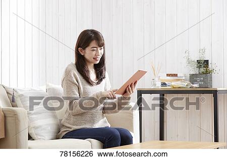 Japanese woman buying online View Large Photo Image Stock Photograph - Japanese woman buying online. Fotosearch