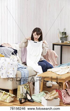 Japanese woman buying online View Large Photo Image Stock Photograph - Japanese woman buying online. Fotosearch