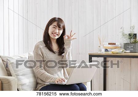 Japanese woman buying online View Large Photo Image Stock Photography - Japanese woman buying online. Fotosearch