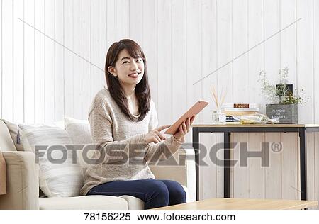Japanese woman buying online View Large Photo Image Stock Photography - Japanese woman buying online. Fotosearch