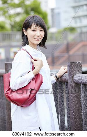 Japanese woman downtown Tokyo View Large Photo Image Stock Image - Japanese woman downtown Tokyo. Fotosearch