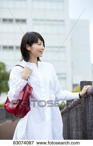 Japanese woman downtown Tokyo View Large Photo Image Stock Photo - Japanese woman downtown Tokyo. Fotosearch