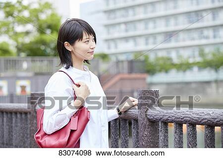Japanese woman downtown Tokyo View Large Photo Image Stock Photo - Japanese woman downtown Tokyo. Fotosearch