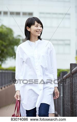 Japanese woman downtown Tokyo View Large Photo Image Stock Photograph - Japanese woman downtown Tokyo. Fotosearch