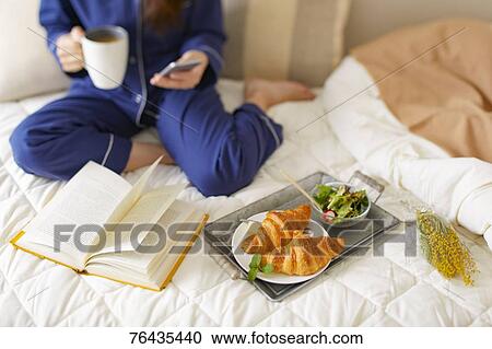 Japanese woman having breakfast in bed View Large Photo Image Stock Image - Japanese woman having breakfast in bed. Fotosearch