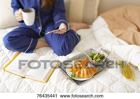Japanese woman having breakfast in bed View Large Photo Image Stock Image - Japanese woman having breakfast in bed. Fotosearch