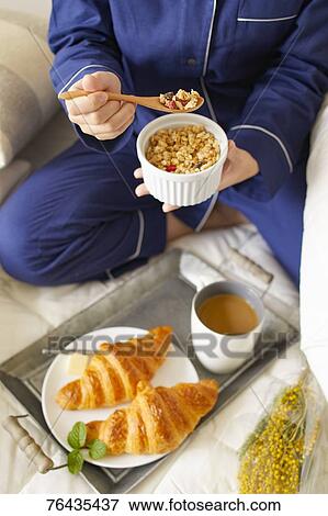 Japanese woman having breakfast in bed View Large Photo Image Stock Photo - Japanese woman having breakfast in bed. Fotosearch