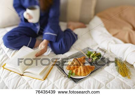 Japanese woman having breakfast in bed View Large Photo Image Stock Photo - Japanese woman having breakfast in bed. Fotosearch