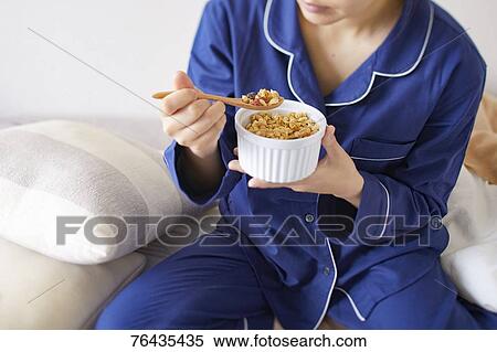 Japanese woman having breakfast in bed View Large Photo Image Stock Photography - Japanese woman having breakfast in bed. Fotosearch