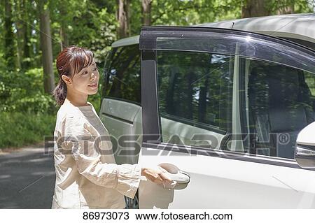 Japanese woman in the car View Large Photo Image Stock Image - Japanese woman in the car. Fotosearch