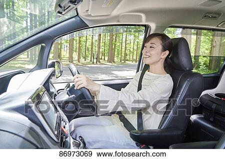 Stock Photo - Japanese woman in the car. Fotosearch