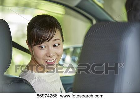 Japanese woman in the car View Large Photo Image Stock Photograph - Japanese woman in the car. Fotosearch