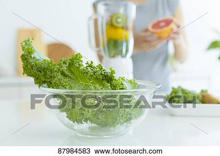 Japanese woman making smoothie in the kitchen View Large Photo Image Stock Image - Japanese woman making smoothie in the kitchen. Fotosearch