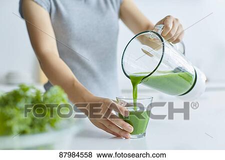 Japanese woman making smoothie in the kitchen View Large Photo Image Stock Photo - Japanese woman making smoothie in the kitchen. Fotosearch