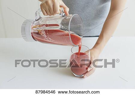 Japanese woman making smoothie in the kitchen View Large Photo Image Stock Photograph - Japanese woman making smoothie in the kitchen. Fotosearch