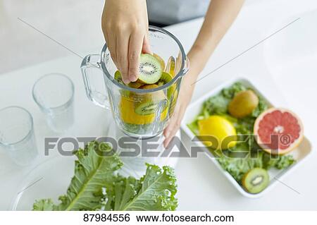 Japanese woman making smoothie in the kitchen View Large Photo Image Stock Photograph - Japanese woman making smoothie in the kitchen. Fotosearch