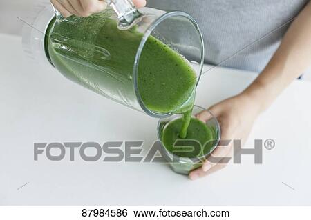 Japanese woman making smoothie in the kitchen View Large Photo Image Stock Photograph - Japanese woman making smoothie in the kitchen. Fotosearch