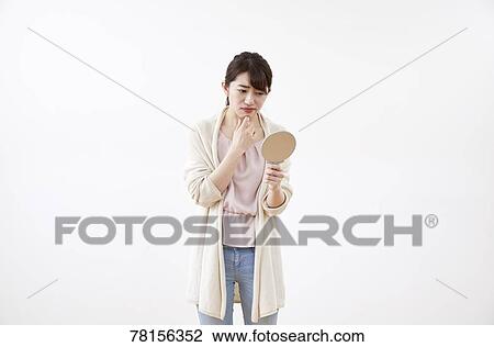 Stock Image - Japanese woman on white background. Fotosearch