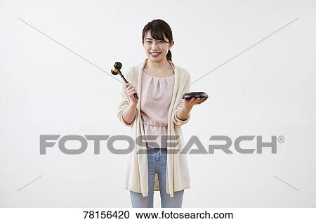 Stock Image - Japanese woman on white background. Fotosearch