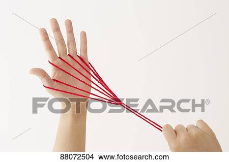 Japanese woman playing with red string View Large Photo Image Picture - Japanese woman playing with red string. Fotosearch