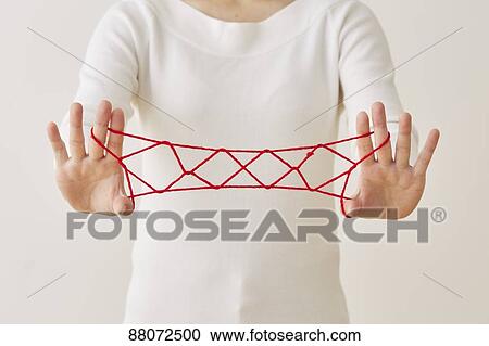 Japanese woman playing with red string View Large Photo Image Stock Image - Japanese woman playing with red string. Fotosearch