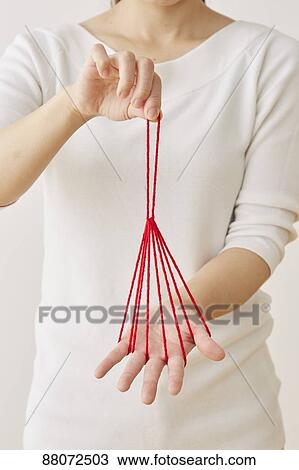 Japanese woman playing with red string View Large Photo Image Stock Image - Japanese woman playing with red string. Fotosearch