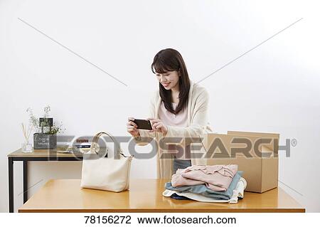 Japanese woman selling online View Large Photo Image Stock Image - Japanese woman selling online. Fotosearch
