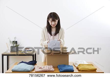 Japanese woman selling online View Large Photo Image Stock Photo - Japanese woman selling online. Fotosearch