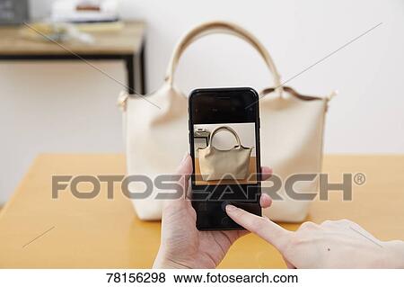 Stock Photo - Japanese woman selling online. Fotosearch