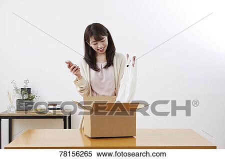 Japanese woman selling online View Large Photo Image Stock Photography - Japanese woman selling online. Fotosearch