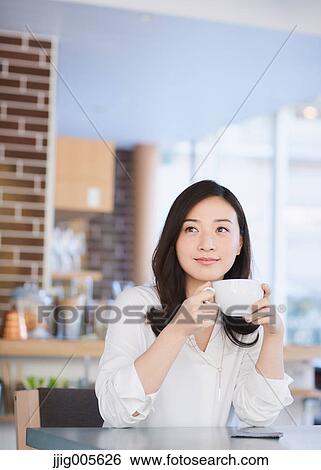 Stock Photograph - Japanese woman stylish cafe. Fotosearch