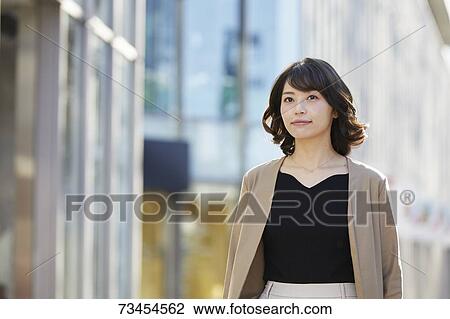 Japanese woman window shopping downtown Tokyo View Large Photo Image Stock Image - Japanese woman window shopping downtown Tokyo. Fotosearch