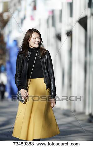 Japanese woman window shopping downtown Tokyo View Large Photo Image Stock Image - Japanese woman window shopping downtown Tokyo. Fotosearch