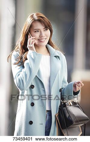 Japanese woman window shopping downtown Tokyo View Large Photo Image Stock Image - Japanese woman window shopping downtown Tokyo. Fotosearch