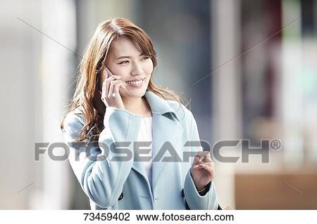 Japanese woman window shopping downtown Tokyo View Large Photo Image Stock Image - Japanese woman window shopping downtown Tokyo. Fotosearch