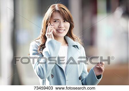 Japanese woman window shopping downtown Tokyo View Large Photo Image Stock Image - Japanese woman window shopping downtown Tokyo. Fotosearch