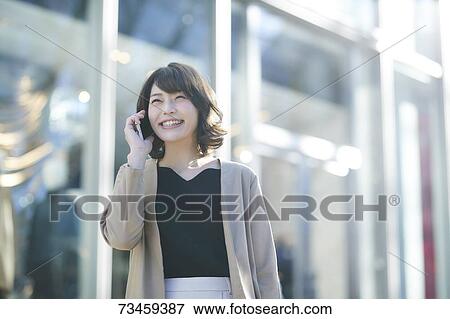 Japanese woman window shopping downtown Tokyo View Large Photo Image Stock Photo - Japanese woman window shopping downtown Tokyo. Fotosearch