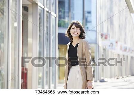 Japanese woman window shopping downtown Tokyo View Large Photo Image Stock Photography - Japanese woman window shopping downtown Tokyo. Fotosearch