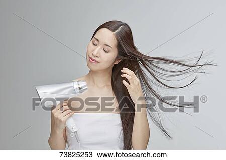 Japanese woman with silky hair View Large Photo Image Stock Image - Japanese woman with silky hair. Fotosearch