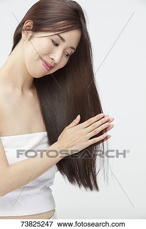Japanese woman with silky hair View Large Photo Image Stock Photo - Japanese woman with silky hair. Fotosearch