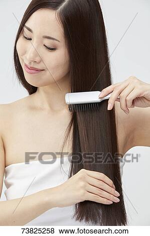 Japanese woman with silky hair View Large Photo Image Stock Photo - Japanese woman with silky hair. Fotosearch