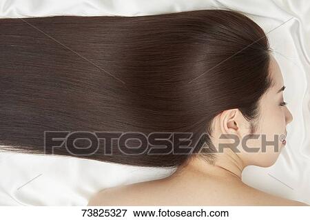 Stock Photo - Japanese woman with silky hair. Fotosearch