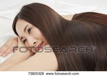 Japanese woman with silky hair View Large Photo Image Stock Photo - Japanese woman with silky hair. Fotosearch