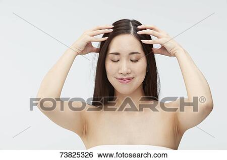 Japanese woman with silky hair View Large Photo Image Stock Photograph - Japanese woman with silky hair. Fotosearch