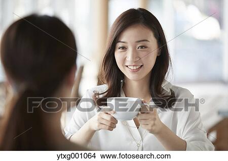 Japanese women in a stylish cafe View Large Photo Image Picture - Japanese women in a stylish cafe. Fotosearch