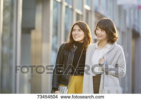 Japanese women window shopping downtown Tokyo View Large Photo Image Picture - Japanese women window shopping downtown Tokyo. Fotosearch