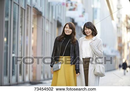 Japanese women window shopping downtown Tokyo View Large Photo Image Stock Image - Japanese women window shopping downtown Tokyo. Fotosearch